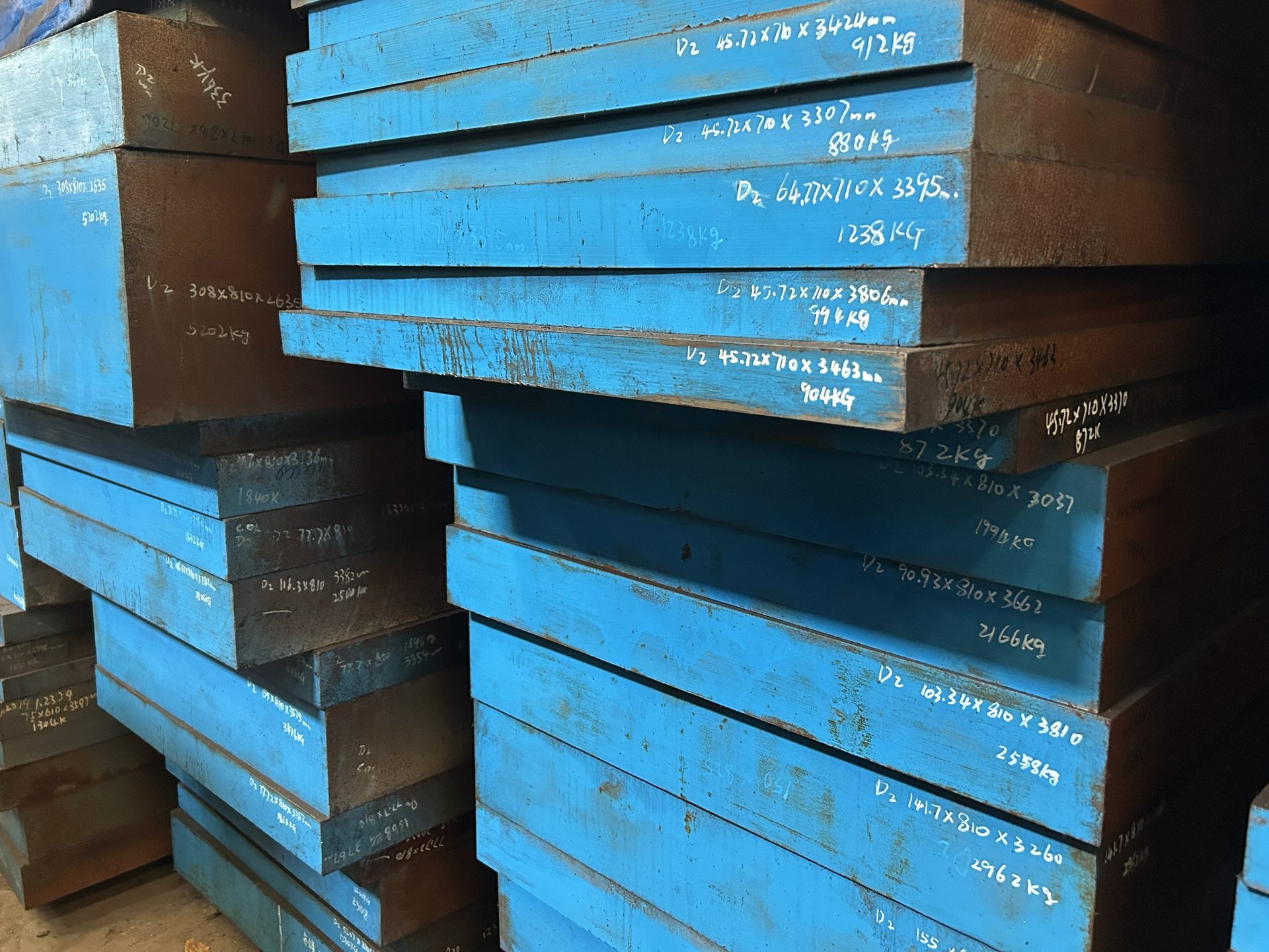 D2 tool steel plate — stacked plates with size and weight markings on the ends